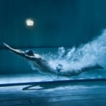 professional swimmer underwater after the jump